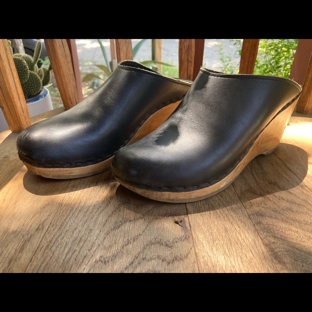 Sven black leather clogs.